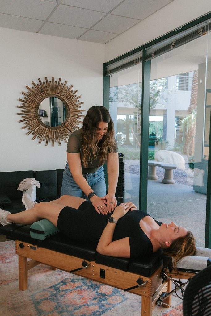 Dr. Paris performing the Webster Technique on a pregnant patient at Adjustology Holistic Family Chiropractic in North Scottsdale, Arizona.